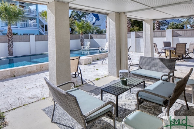 view of terrace featuring a fenced in pool