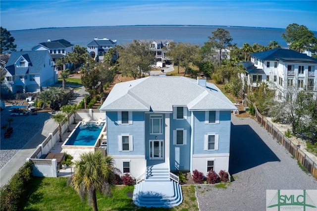 birds eye view of property with a water view