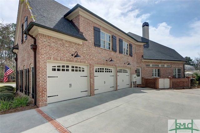 view of side of property with a garage