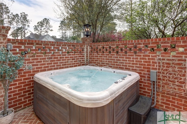 exterior space featuring a hot tub