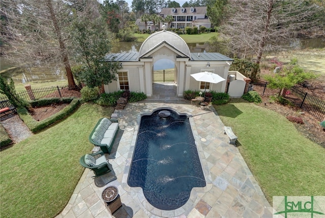 view of front facade featuring a fenced in pool, pool water feature, a patio area, an outdoor structure, and a front yard