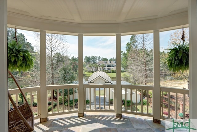 unfurnished sunroom with plenty of natural light