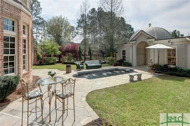 view of yard with an outdoor living space and a patio area