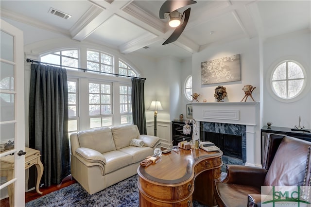 interior space with dark wood-type flooring, a healthy amount of sunlight, coffered ceiling, and a premium fireplace