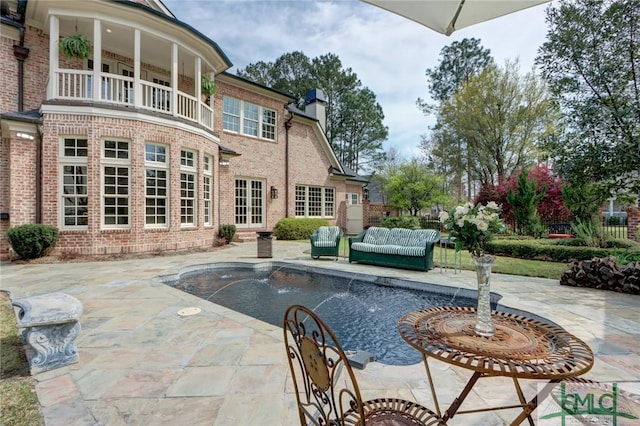 exterior space with a patio and a balcony