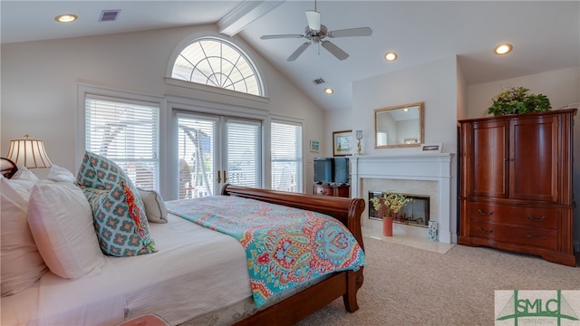 carpeted bedroom with ceiling fan, beamed ceiling, and high vaulted ceiling