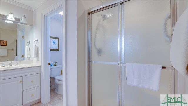 bathroom with toilet, a shower with door, vanity with extensive cabinet space, and tile flooring
