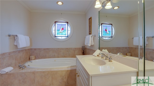 bathroom with a relaxing tiled bath, vanity with extensive cabinet space, and crown molding
