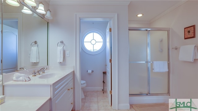 bathroom with toilet, vanity with extensive cabinet space, crown molding, a shower with shower door, and tile flooring