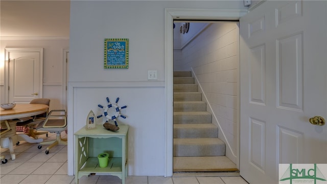 stairs with light tile floors