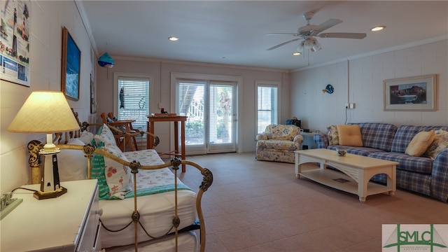 living room with tile flooring, ceiling fan, and crown molding