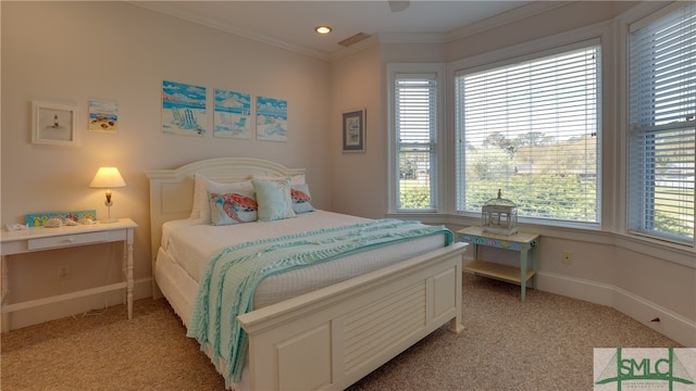 carpeted bedroom with multiple windows and ornamental molding