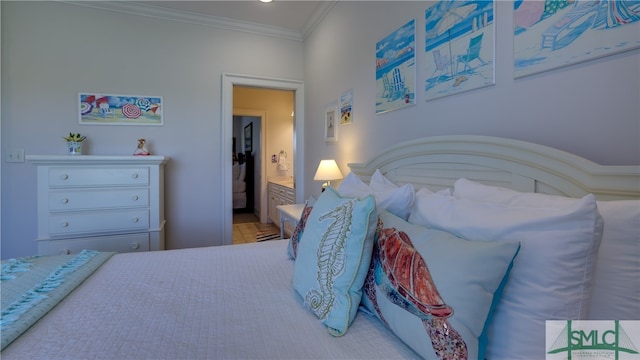 bedroom featuring crown molding and ensuite bathroom