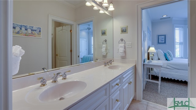 bathroom featuring ornamental molding, tile floors, dual sinks, and large vanity
