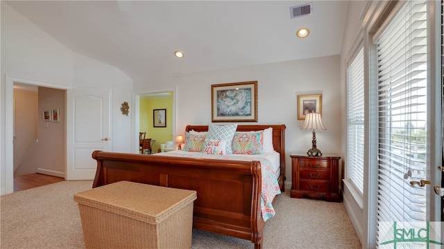 bedroom featuring vaulted ceiling and light hardwood / wood-style flooring