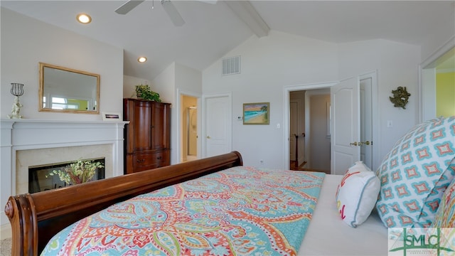 bedroom featuring ceiling fan and lofted ceiling with beams