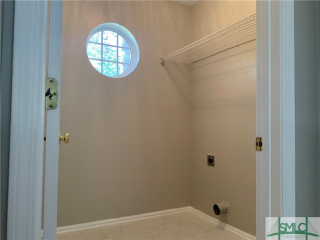 washroom with light tile flooring and electric dryer hookup