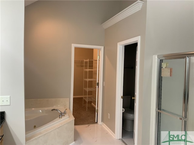 bathroom featuring shower with separate bathtub, tile floors, toilet, and ornamental molding