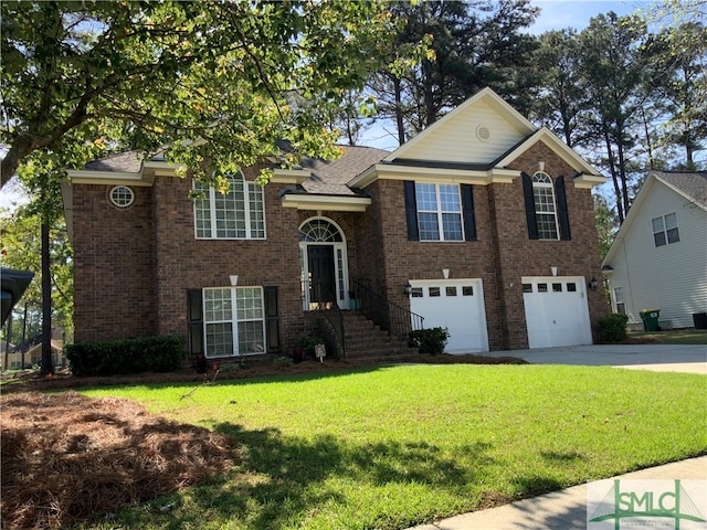 view of front of house featuring a front lawn and a garage