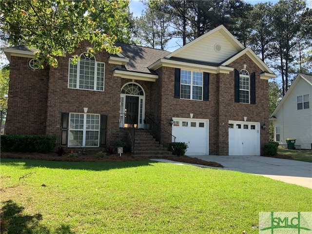 split foyer home with a front lawn and a garage