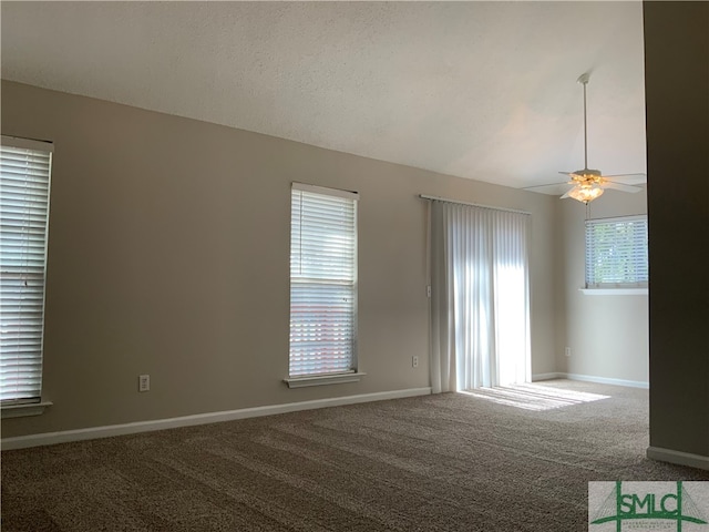 empty room featuring carpet flooring, a textured ceiling, and ceiling fan