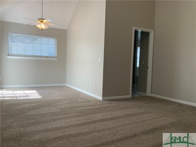 carpeted empty room with high vaulted ceiling and ceiling fan