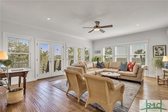 living room with french doors, ceiling fan, hardwood / wood-style flooring, and crown molding