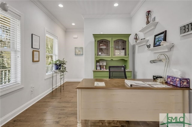 home office with wood-type flooring and crown molding