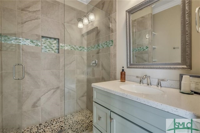 bathroom featuring vanity and an enclosed shower