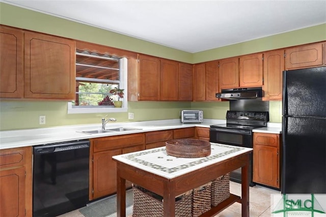 kitchen with sink, light tile patterned floors, black appliances, and extractor fan