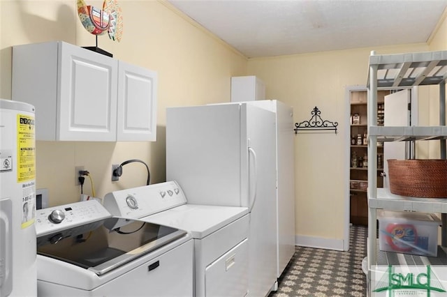 clothes washing area featuring cabinets, separate washer and dryer, crown molding, and water heater