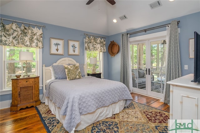 bedroom featuring access to exterior, ceiling fan, french doors, dark hardwood / wood-style flooring, and vaulted ceiling