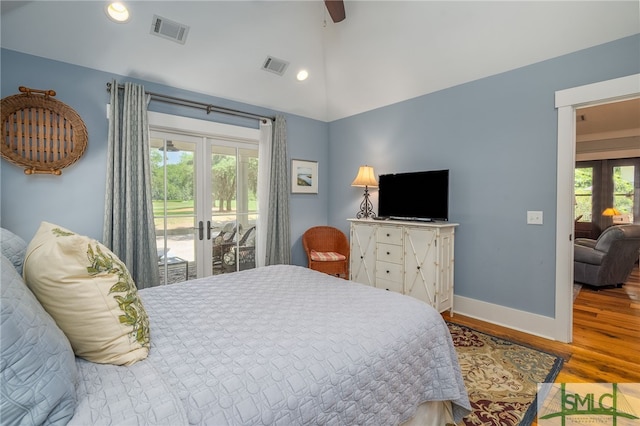 bedroom featuring french doors, access to outside, ceiling fan, wood-type flooring, and lofted ceiling