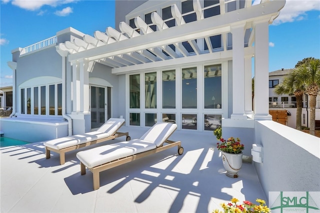 view of patio / terrace featuring a pergola and french doors