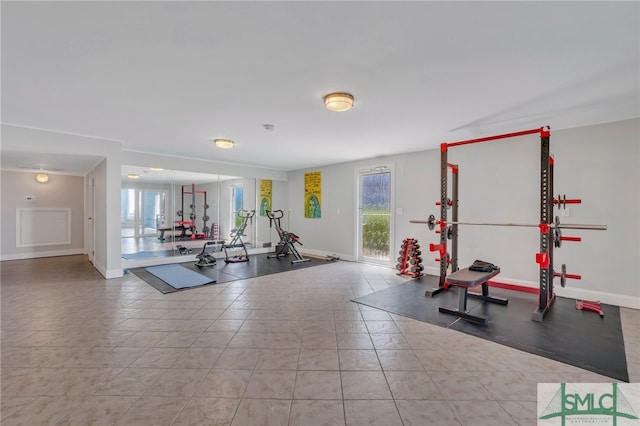 workout area featuring light tile flooring