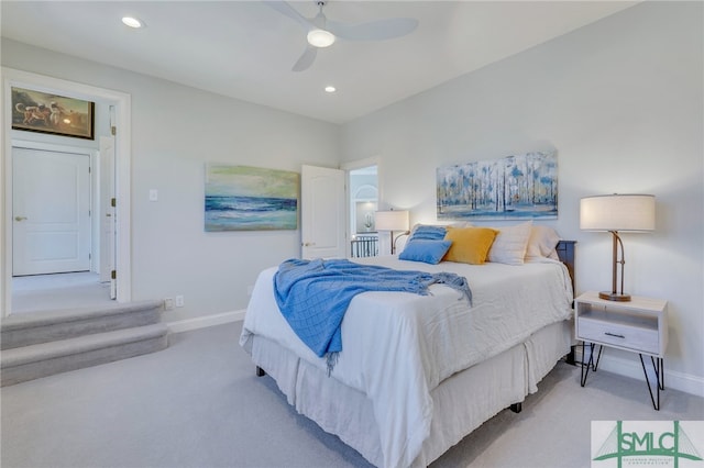 bedroom with ceiling fan and light colored carpet