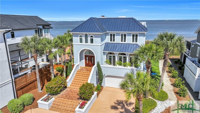 view of front facade with a water view