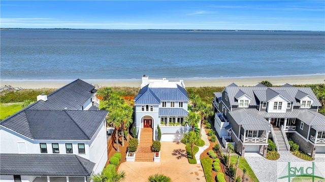 aerial view featuring a water view and a view of the beach