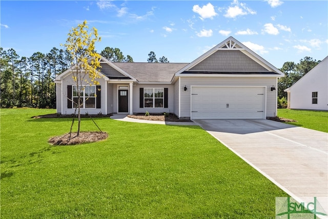 view of front of property with a front yard and a garage