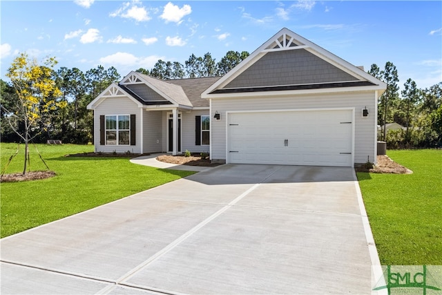 craftsman-style house featuring a front yard and a garage