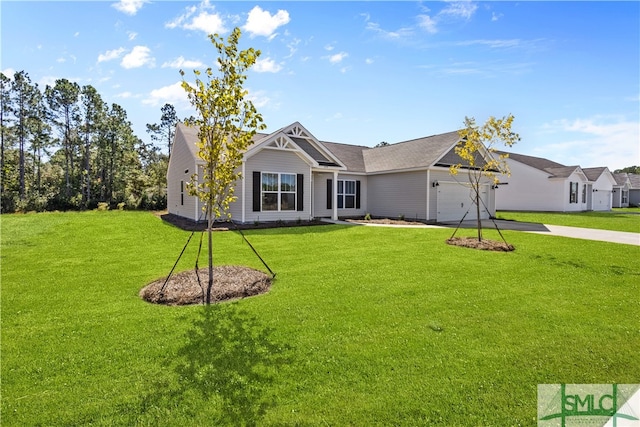 view of front of property featuring a front yard and a garage