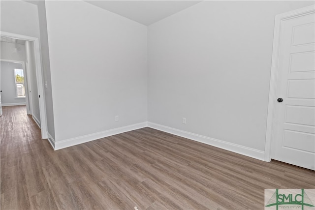 empty room featuring wood-type flooring