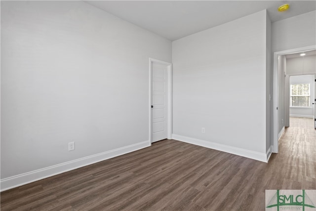 spare room featuring dark hardwood / wood-style flooring