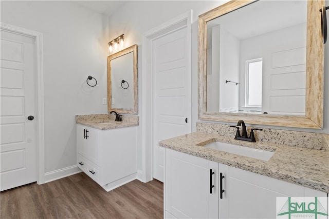 bathroom featuring vanity and hardwood / wood-style floors