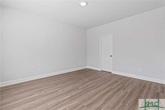 empty room with light hardwood / wood-style floors