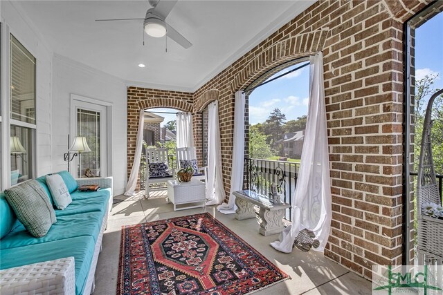 sunroom / solarium with ceiling fan