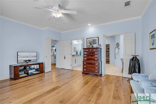 interior space featuring light hardwood / wood-style flooring, ceiling fan, and crown molding