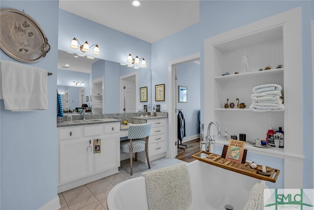 bathroom with tile flooring and oversized vanity