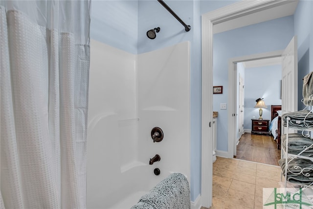 bathroom featuring shower / bath combination with curtain and tile floors