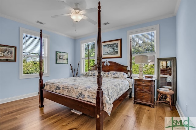 bedroom featuring ornamental molding, light hardwood / wood-style floors, and ceiling fan